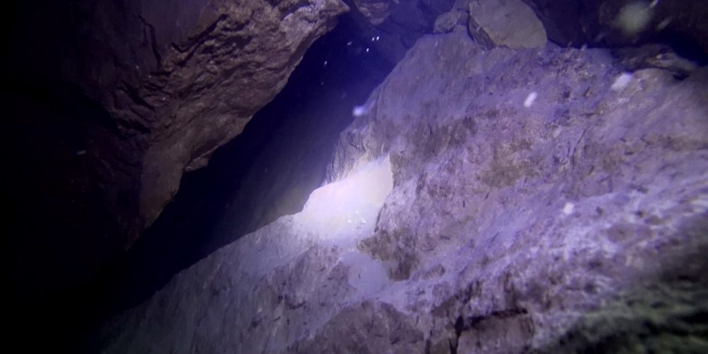 In Russia, divers have discovered a cave at the bottom of a lake