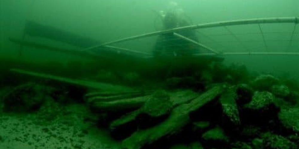 What is hidden at the bottom of the Vistula Lagoon?